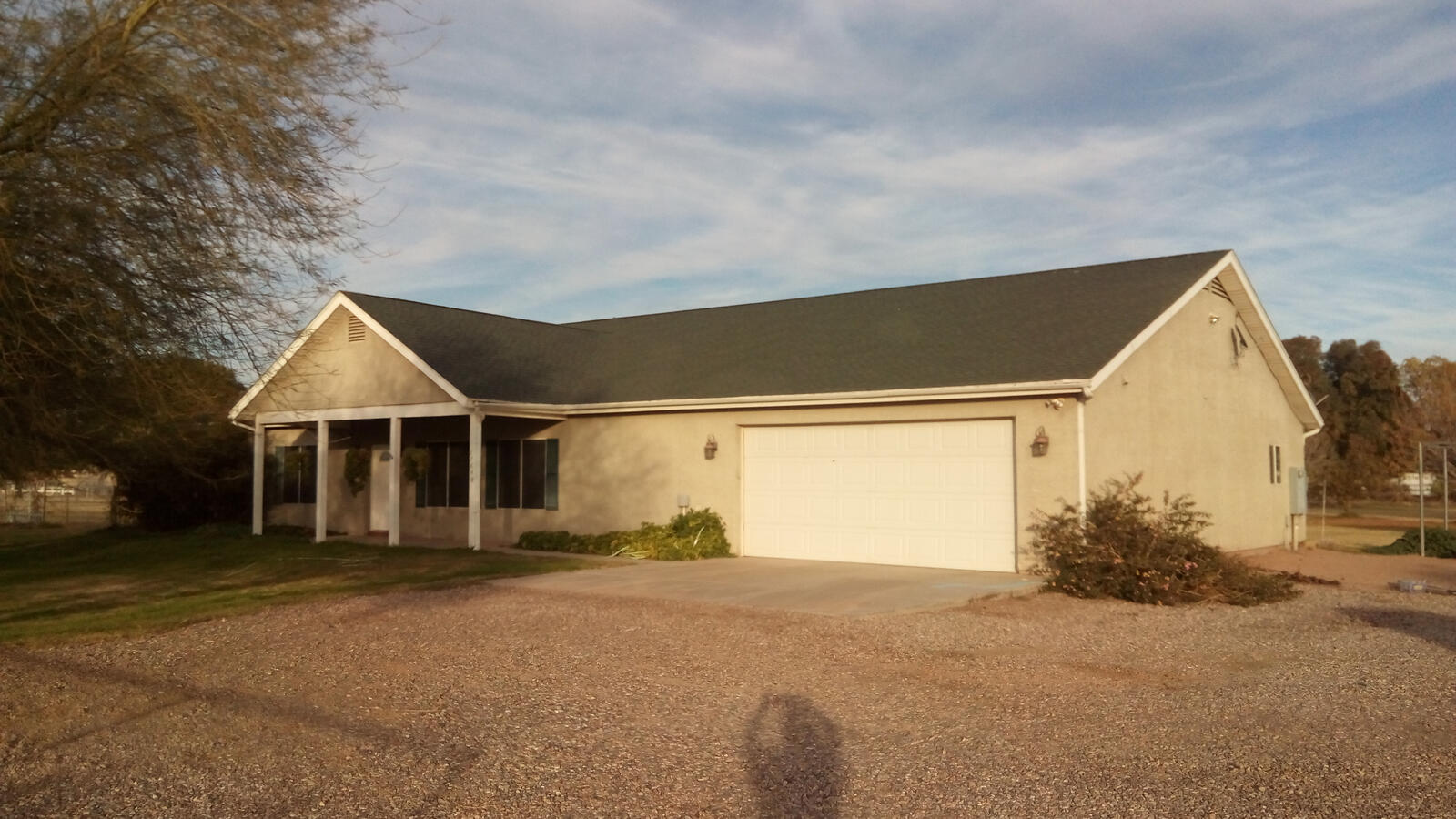 Beige house with dark roof